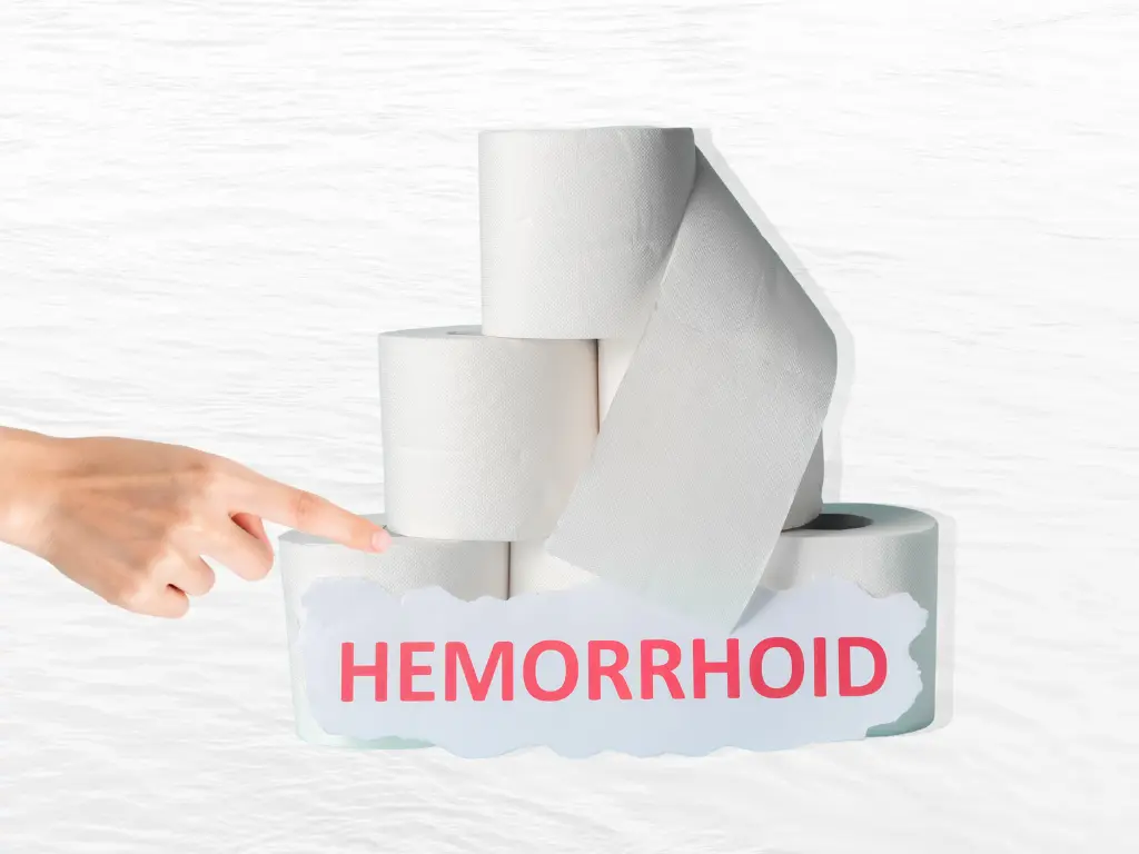 a hand and a pile of toilet paper with a sign in front reading hemorrhoid